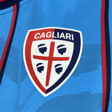 Camisola Cagliari 2025-26 Alternativa Azul Versão Adepto